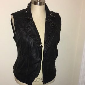 Size large Studded faux leather vest.
